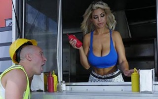 Bridgette B serving a pair of big tits at her hotdog stand!